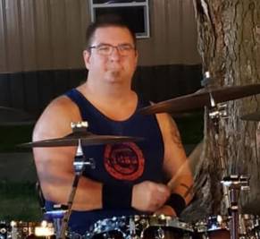 A person playing a drum setAI-generated content may be incorrect.